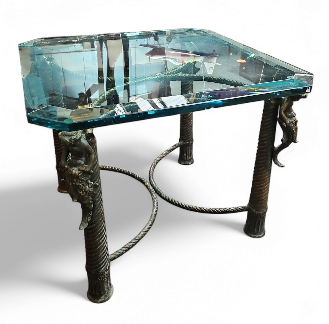 Bronze Cherub Table with Bevelled Glass Top.: This table is decorated with cherubs that look like mermaids. The removable glass top has several chips and scratches. The square glass top measures 23" x 23". The table measures 18" tall. Third-party