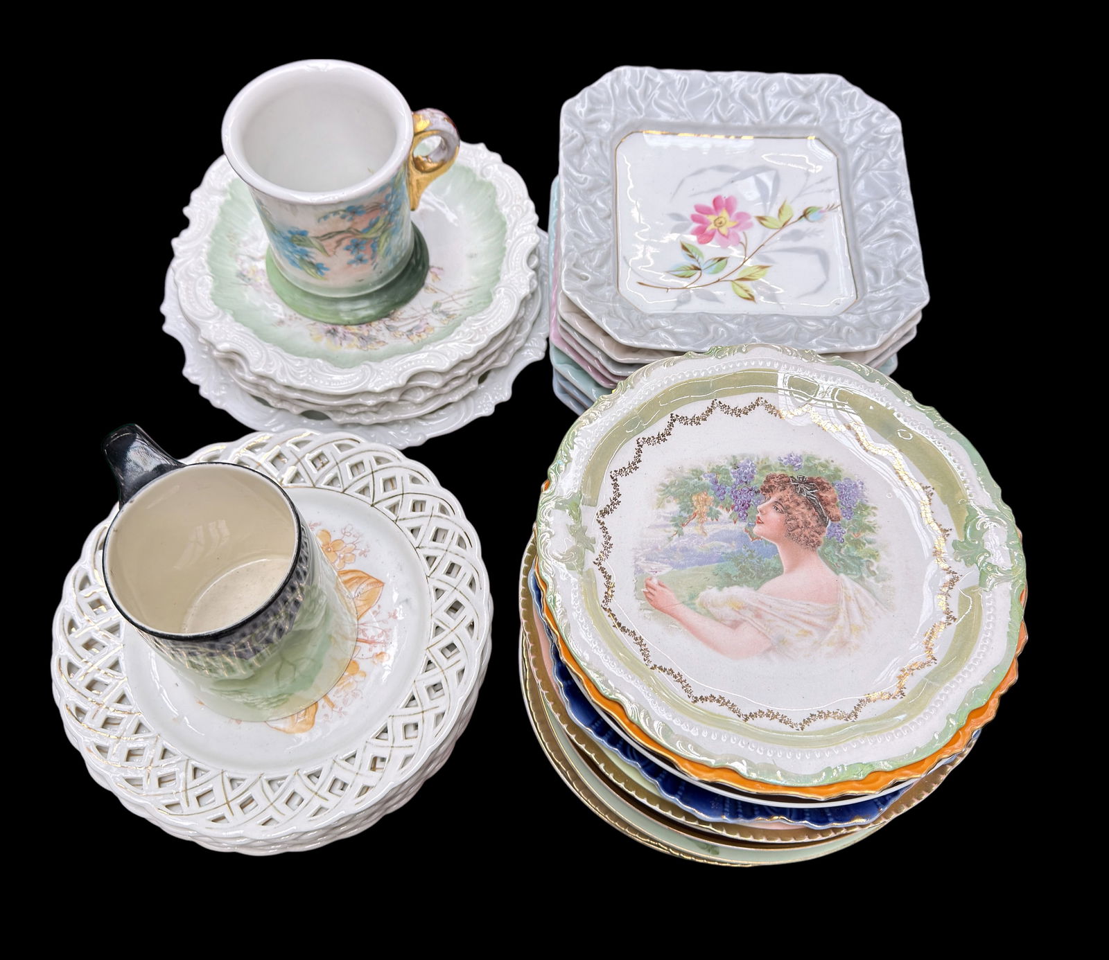 Lot of Antique & Vintage Dishes, inc. Bavarian.: The lot includes pieces by Weimar, Royal Rudolstadt, Turin Bavaria, Belleek Willets, and more. Most of the dishes are plates. Overall, the lot looks to be in good condition. The largest item measures