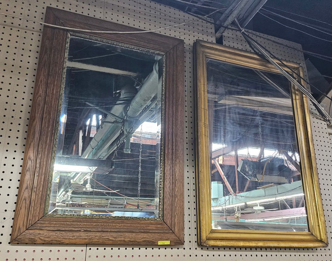 Two Vintage Wall Mirrors.: One mirror is bevelled with a wood frame, while the other has a gilt frame. Both are in good condition, with minor wear. The bevelled mirror measures 36" tall and 23" wide. The gilt mirror measures 36