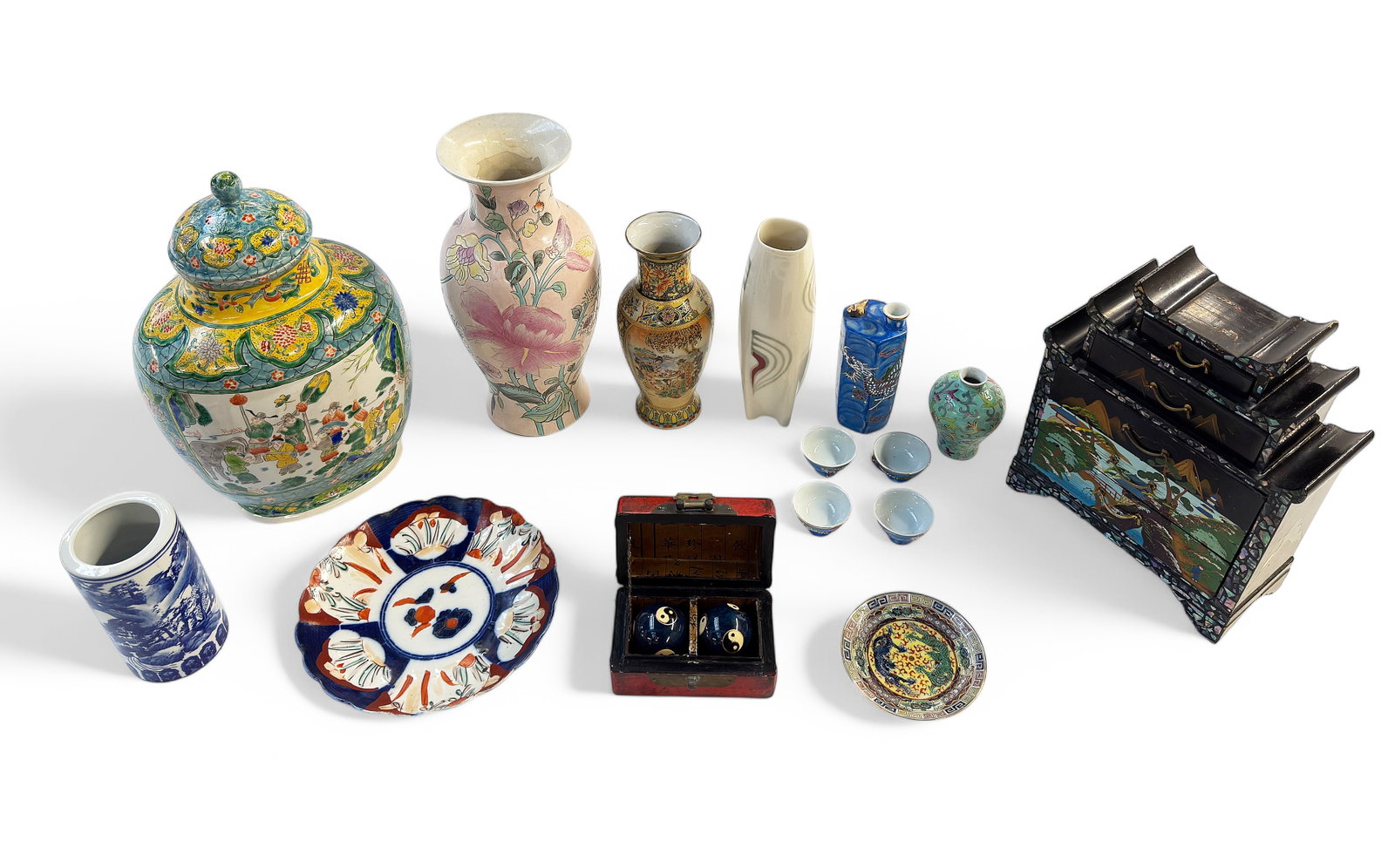Lot: 15 Pcs. Asst. Asian Mostly Porcelain Items.: The items include a jewelry box, a small red box w/ exercising balls, a large covered urn, vases, small cups, etc. - The largest item in the lot is the covered urn, which measures 13 1/4" tall. All it