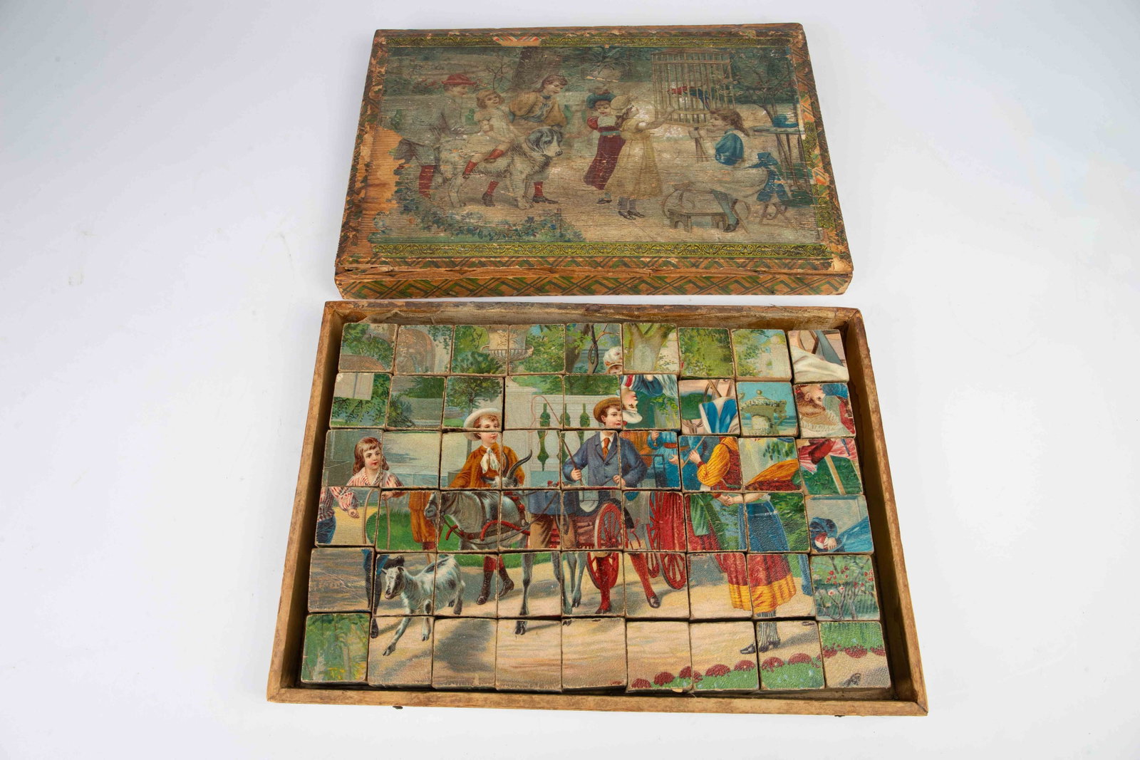 Antique Victorian Cube Puzzle w/ Original Box.: This antique toy comes with its original box and 2 double sided cardboard reference pictures. It comes with 54 cubes. Each cube measures roughly 1 5/8" x 1 5/8". The box measures 11 1/4" x 16" x 3". T