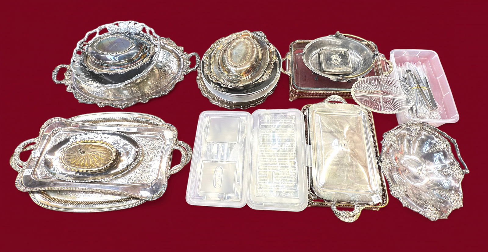 Lot of Silverplate Serving Pcs. & Utensils.: The lot includes over 20 items and over 100 utensils. There are plates, casserole holders, trays, bowls, a basket, a butter dish, a coaster set, and more. Some of the brands observed are W&S Blackinto