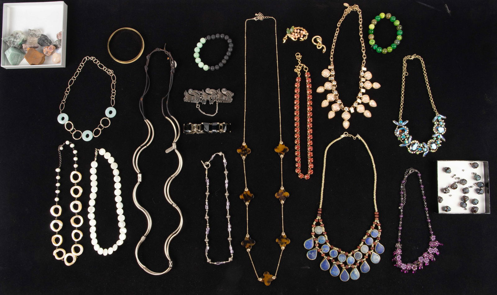 Lot of Costume Jewelry - 925, Lapis, Jade.: The lot includes 18 pieces of jewelry, a small group of beads, and several raw stones. There are 5 bracelets, 11 necklaces, 1 brooch, and 1 pendant. The lot features a Coro sterling silver bracelet wh