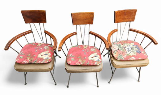Set of Three Richard McCarthy Captain's Chairs.: These Mid-Century Modern dining chairs have iron frames and vinyl upholstered seats. The arms and back rests are made from wood. Each chair comes with a removable floral seat cushion. The upholstery s
