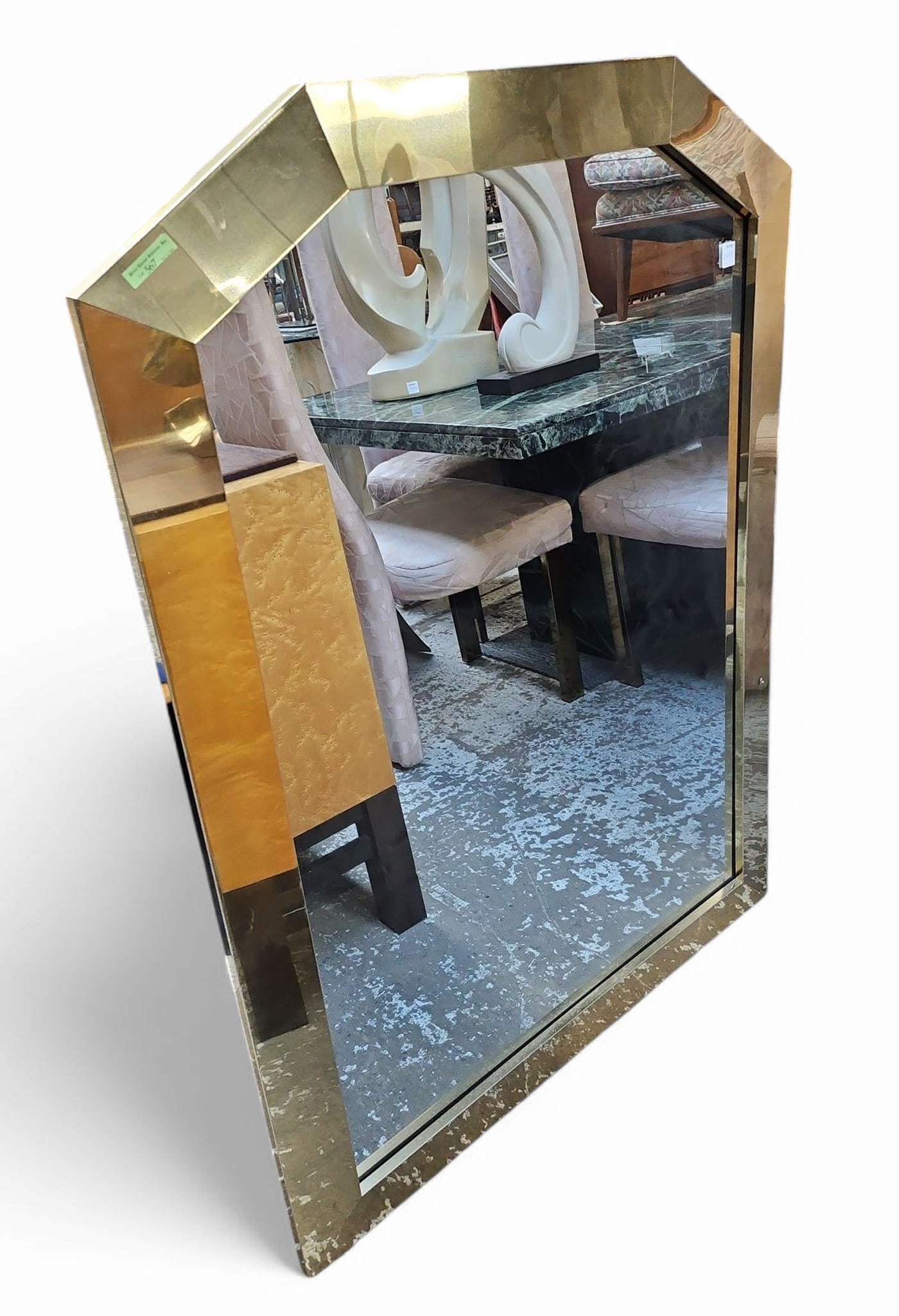Ello Brass Wall Mirror.: The brass frame has a gouge and a few scratches on the right side. Otherwise it is in good condition. There is hardware on the back for hanging. It measures 47" tall and 34" wide. Third-party freight