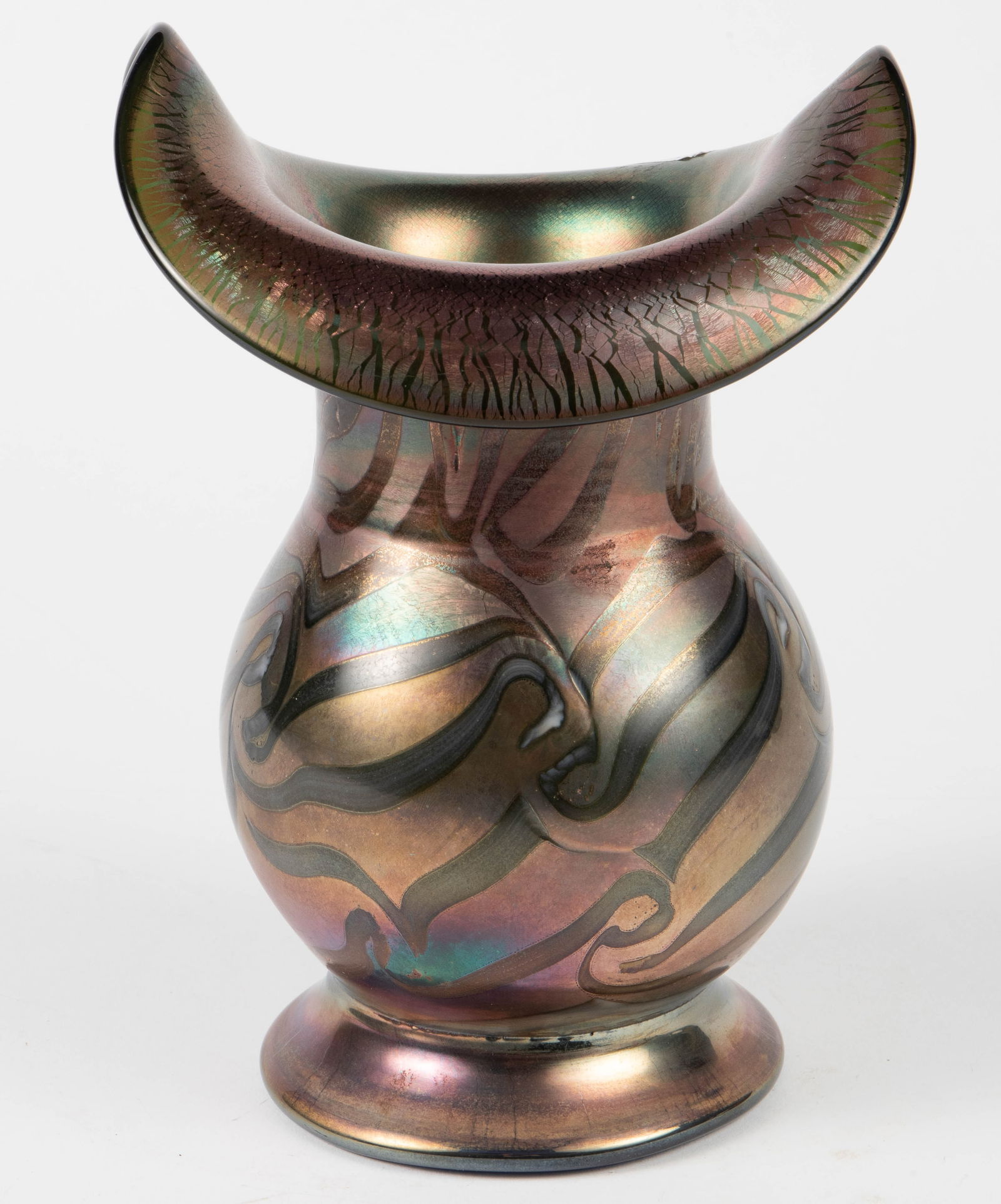 Unsigned Iridescent Glass Vase - Style of Loetz.: The maker is unknown. This deep purple iridescent vase looks to be in good cosmetic conditon. Its dimensions are 8 1/4" tall, and 5 7/8" across the widest area. In-house shipping is available. Please