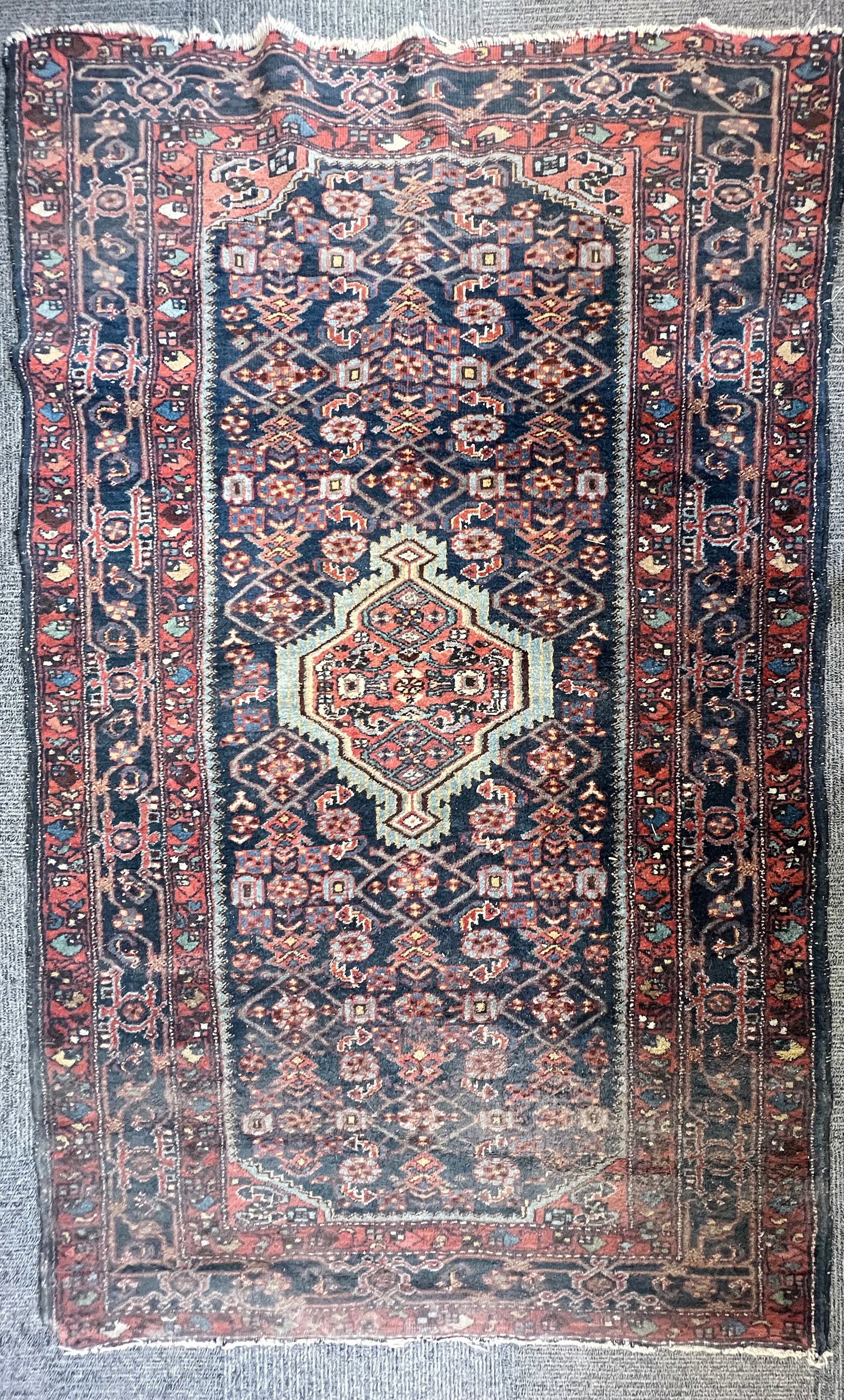 4' x 6 1/2' Older Persian Rug.: The rug is very dusty and dirty. It needs a serious cleaning. One end is partially cut off in the middle of the border. Neither end has a fringe. In-house shipping is available for this rug. Please se