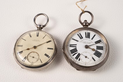 Two Sterling Silver Key Wind Pocket Watches.