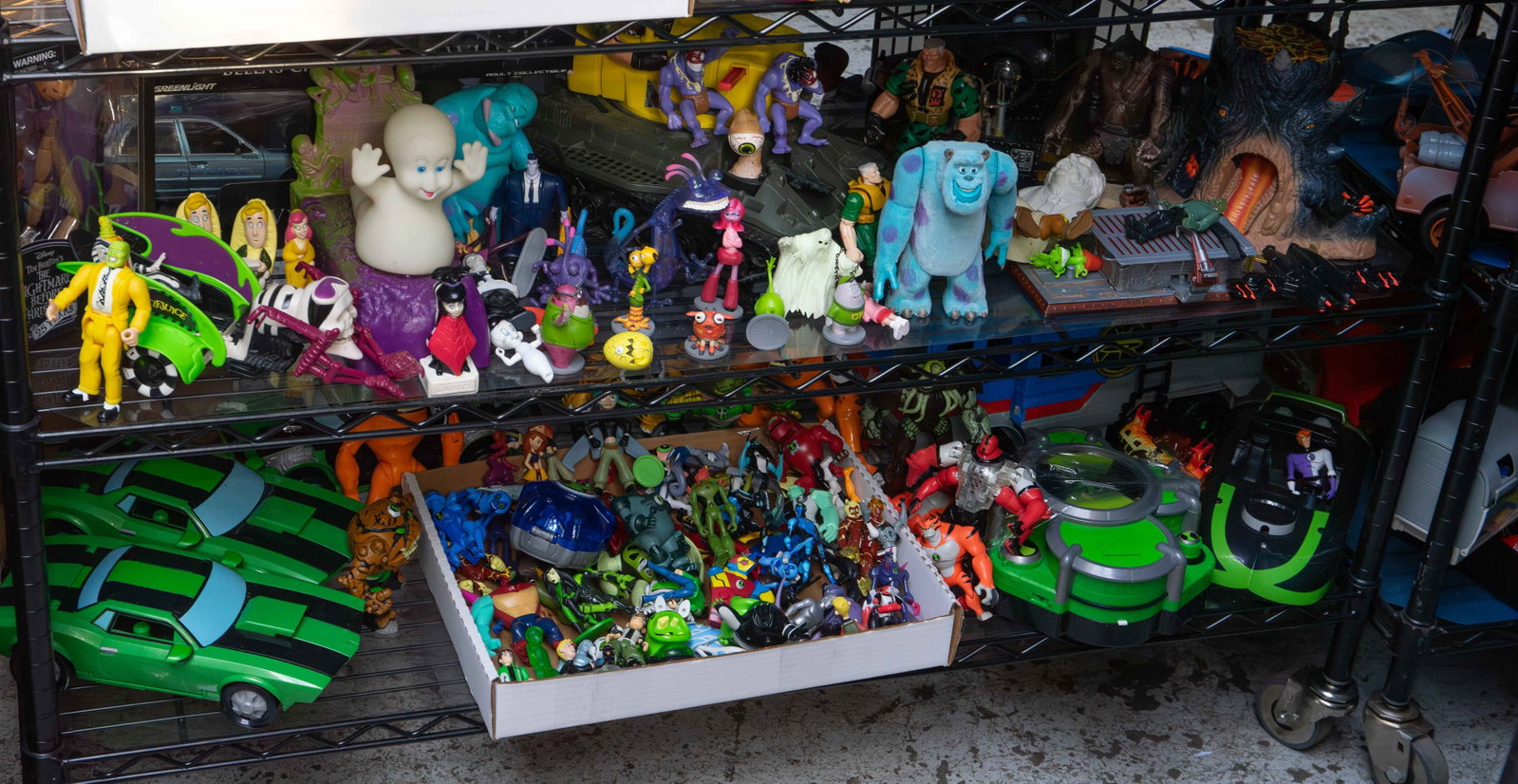 Lot: Beetlejuice, Monsters Inc., & Ben 10 Toys.: The lot contains over 65 toys and figurines from the movies Beetlejuice, Monsters Inc., Twilight, and The Nightmare Before Christmas, as well as the TV show Ben 10. Three of the items are new in their