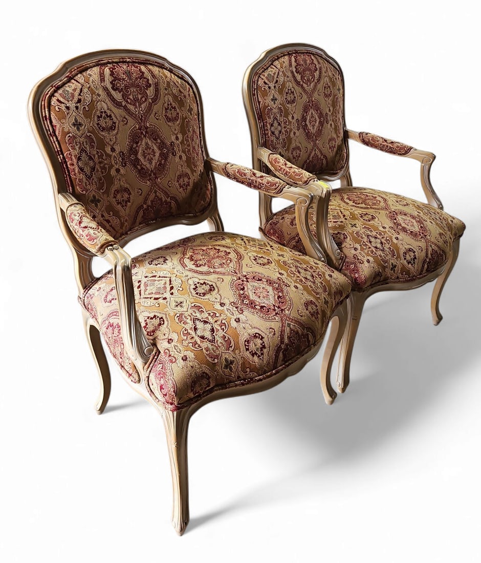 Pair of Louis XV Style Armchairs.: This pair of armchairs has brocade style upholstery, and padded arm rests. They have some minor scratches, but are in good overall condition. Third-party freight shipping or personal pickup is require