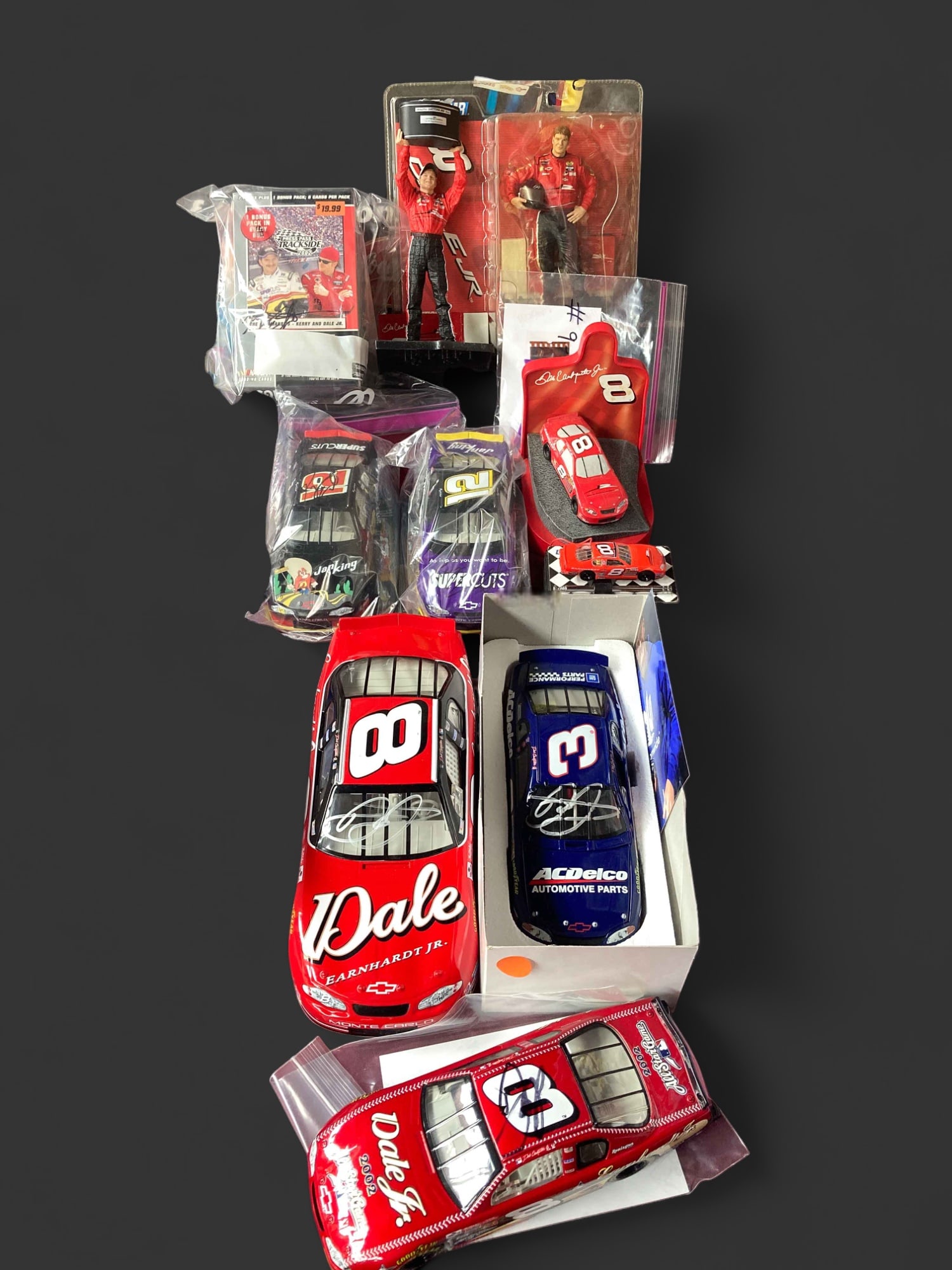Lot of Earnhardt Family Racing Collectibles.: Some are signed by Dale Earnhardt, Jr., with picture proofs. There is also a Kerry Earnhardt signature on the sealed pack of 2002 trading cards. Both Kerry and Dale Jr. have signed several of the die 