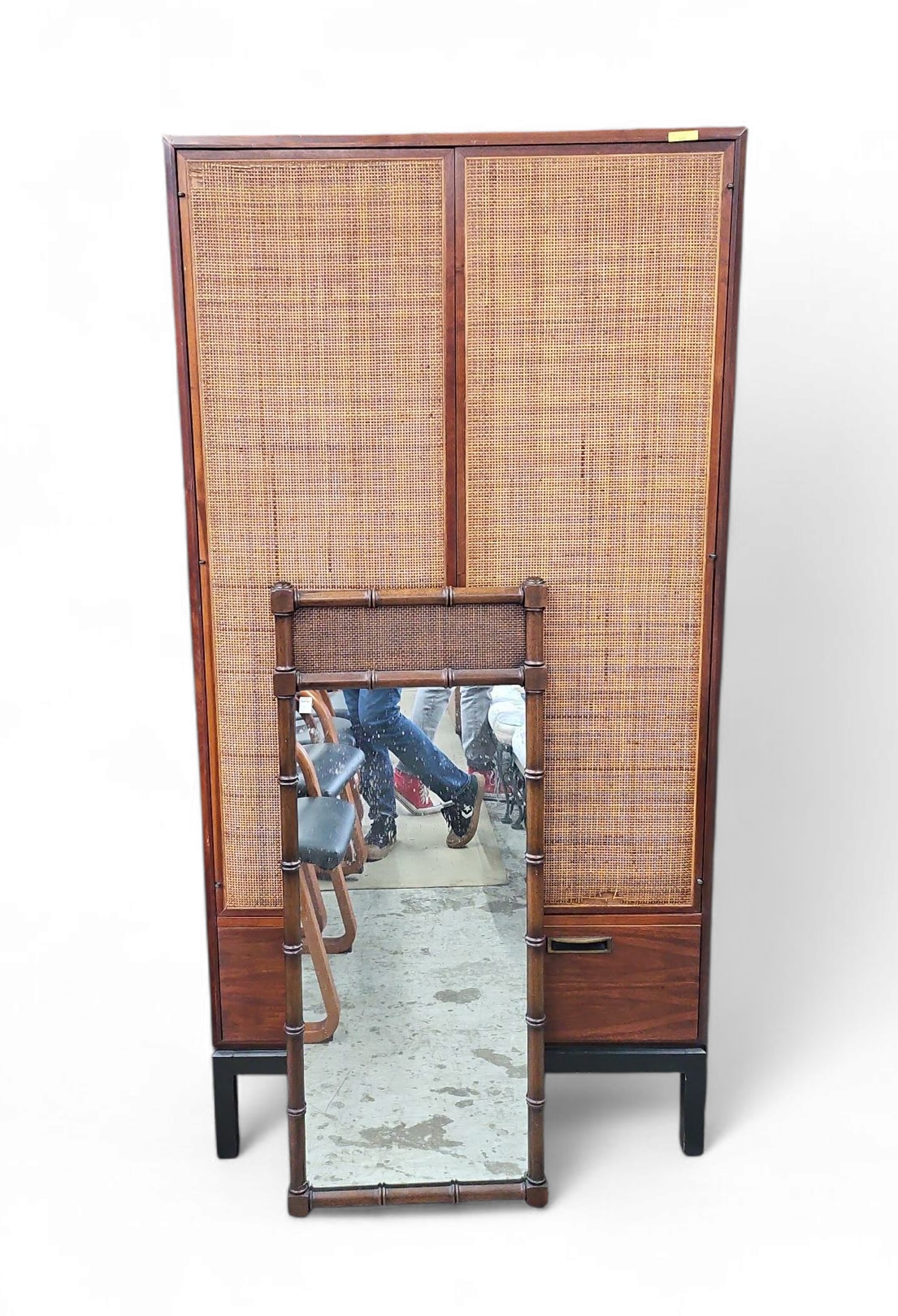 Mid-Century Modern Wardrobe - Jack Cartwright?: This Mid-Century Modern walnut wardrobe is in the style of Jack Cartwright. It has two doors with cane panels, four interior butler drawers, and eight shelves. There is some damage to the cane on the