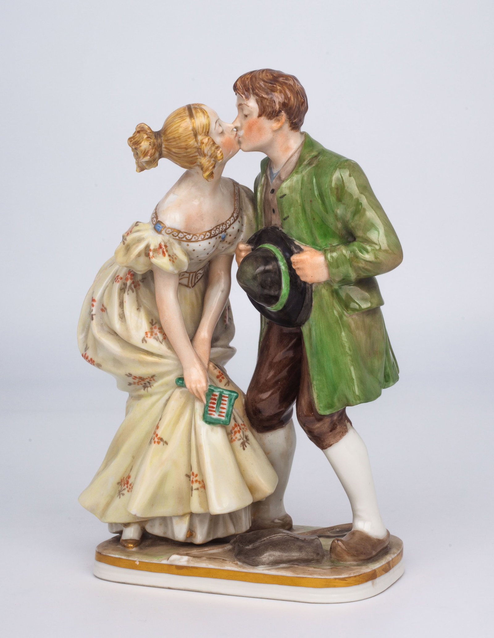Royal Copenhagen "Princess and Swineherd" Figure.: This early 20th century Royal Copenhagen figural group is numbered 1114 on the underside, and is signed on the base by artist Christian Thomsen. The individuals featured are a tall young lady in a fin
