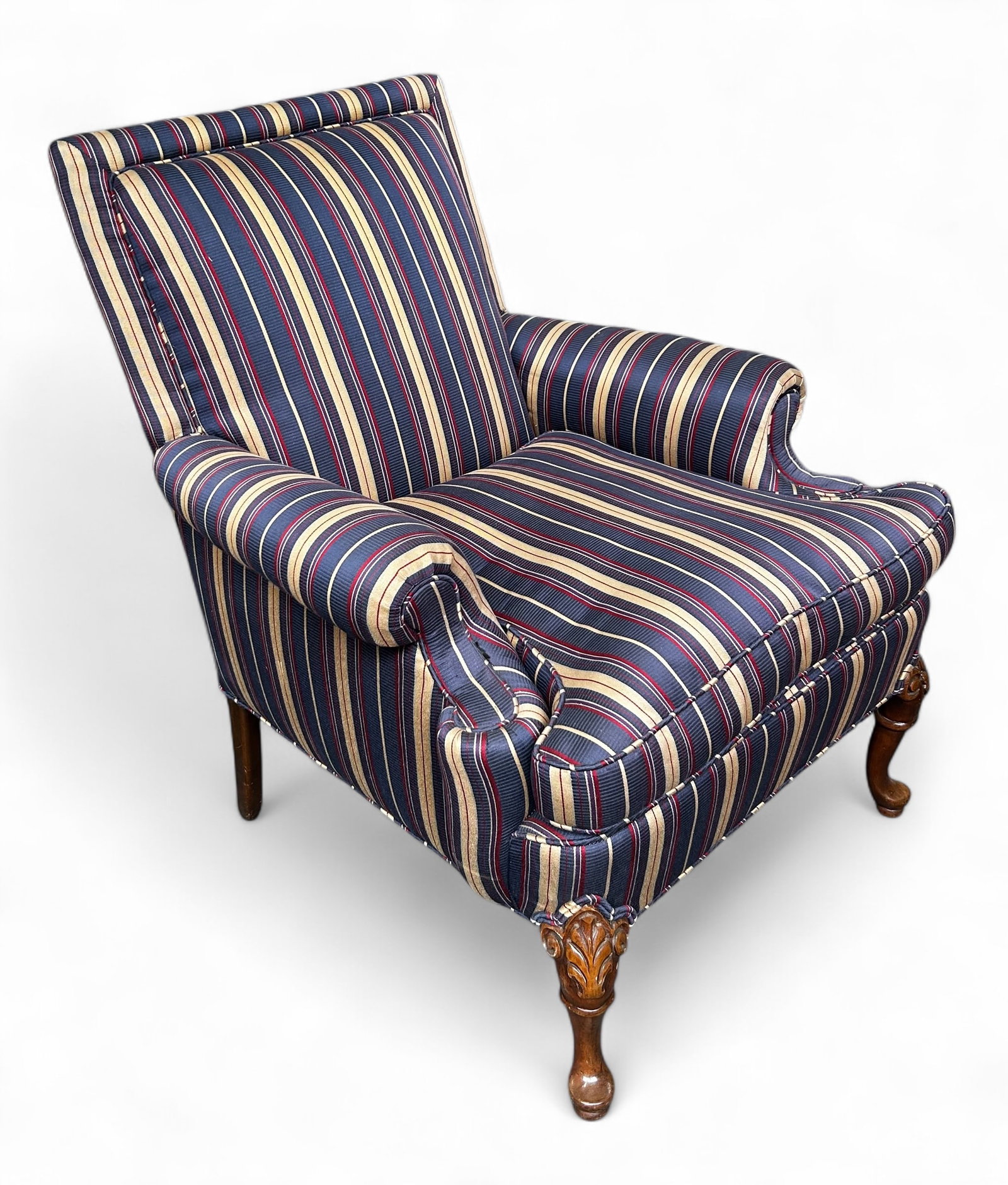 Upholstered Lounge Chair.: This upholstered high back lounge chair has rolled arms, a removable seat cushion, and carved walnut legs. It is very comfortable and sturdy. There are some scratches, but overall, the chair is in goo