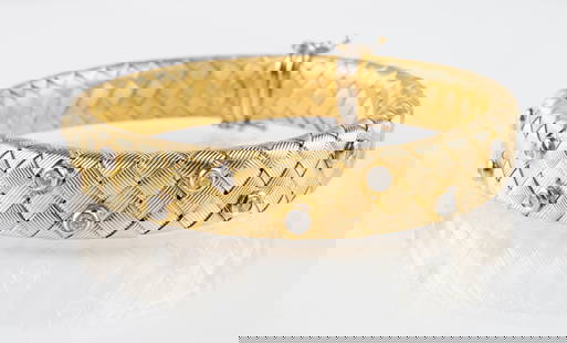 14K Gold & Diamond Designer Bracelet - Daniel W.: The bracelet is marked 14KT / Daniel W. near the clasp. It features a woven design, with 10 small round diamonds on white gold bezels. The diamonds measure 2mm in diameter. The bracelet measures 6 1/2