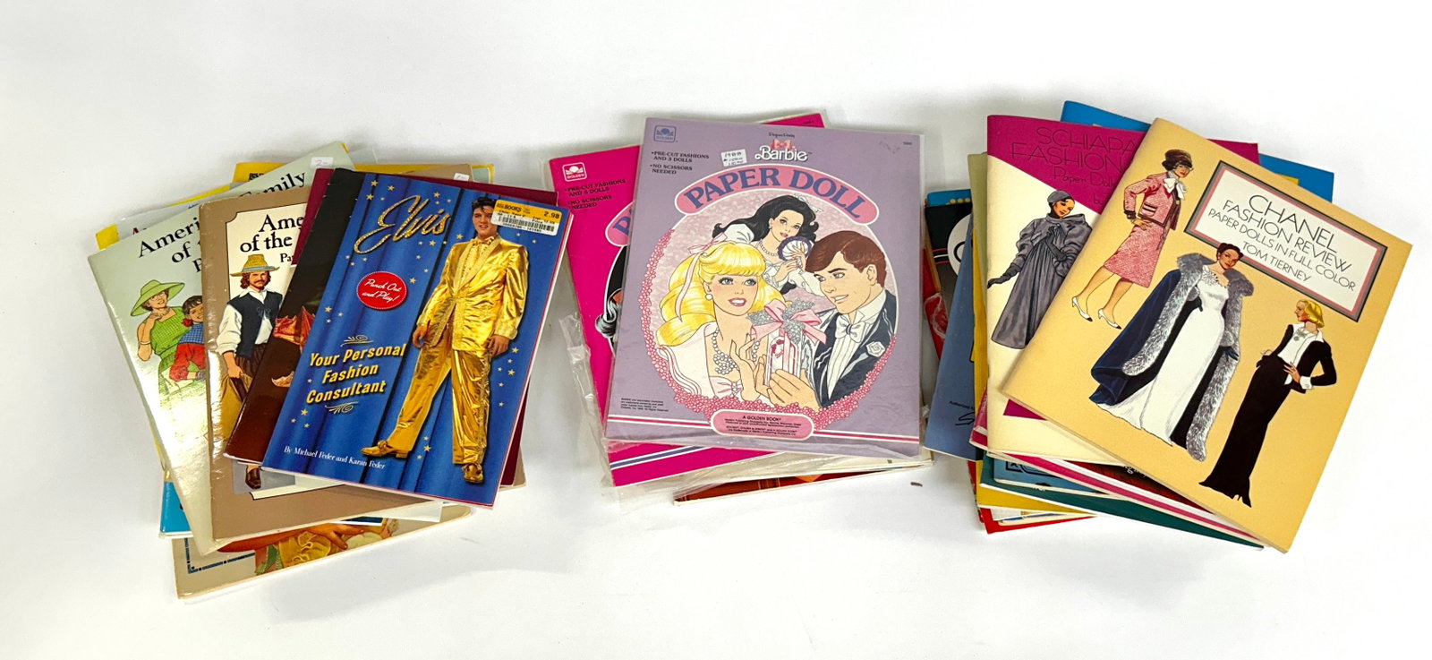 Lot of Paper Doll Books- Tom Tierney & Others.: Most of the items in this lot are Tom Tierney. They include historical, political, and fashion dolls with various outfits. Overall, the lot looks to be in good condition. The largest book measures 13"