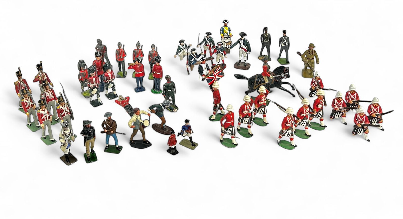 Lot of Assorted Painted Soldiers, Mostly British.: There are 48 figures, most of which are approximately 2" to 3" tall. They include lead, pewter, and plastic miniature soldiers. There are signs of paint loss and surface wear, and some have sustained