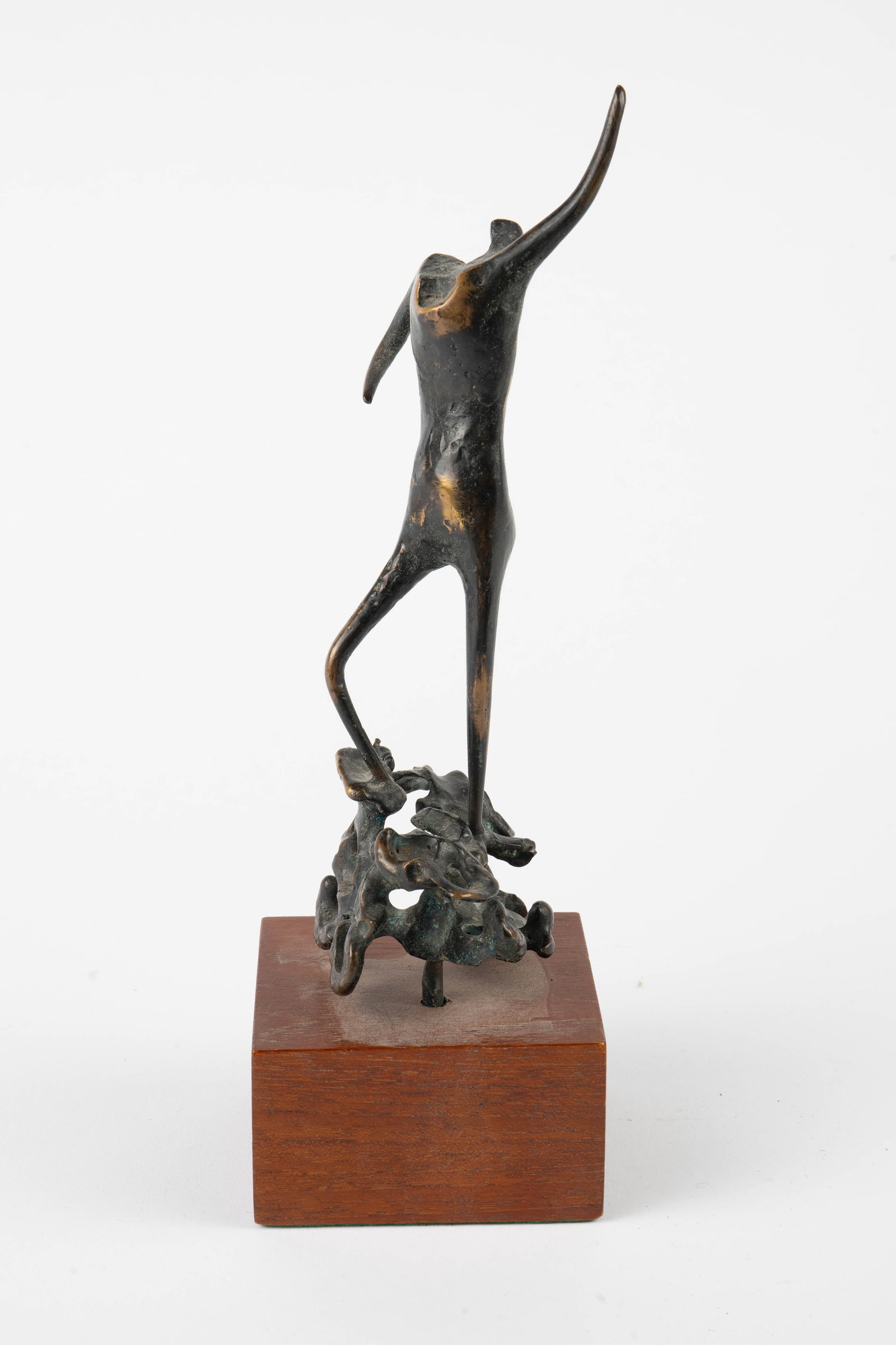 Giacometti Style Bronze Statuette of Human Figure.: This surrealist type bronze appears to be unsigned. The figure is attached to a rectangular wood base. Aside from some dust in the crevices, the piece looks to be in overall good condition. It measure