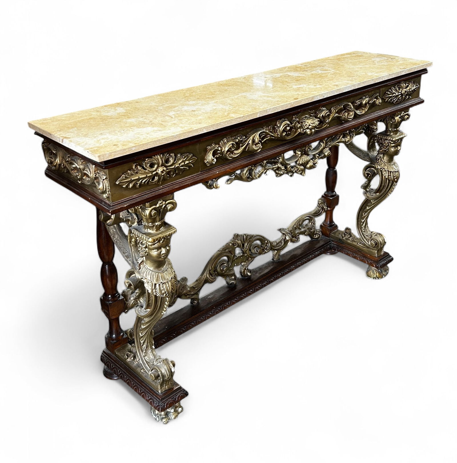 Italian Gilt Gesso Console Table w/ Travertine Top: The Italian table has a single drawer and a caryatid, or draped female figures, supports. It also has floral decorations and paw feet. It measures 35" x 54 1/2" x 14". There are some scratches and ind