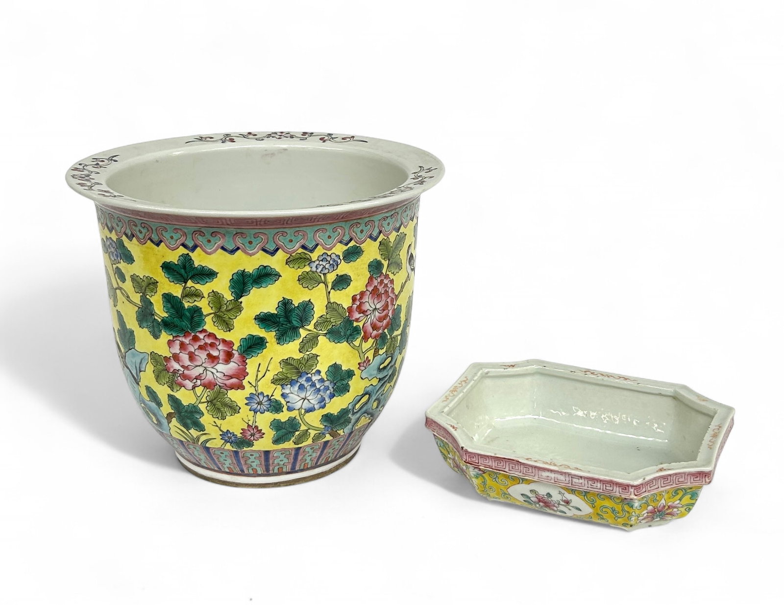 Late 19th / Early 20th Century Chinese Porcelain.: The lot consists of two famile rose porcelain planters. The larger piece is a jardiniere. It has a hole in its bottom. It does not have a mark. It measures 9 1/8" tall and 11" in diameter. The other p