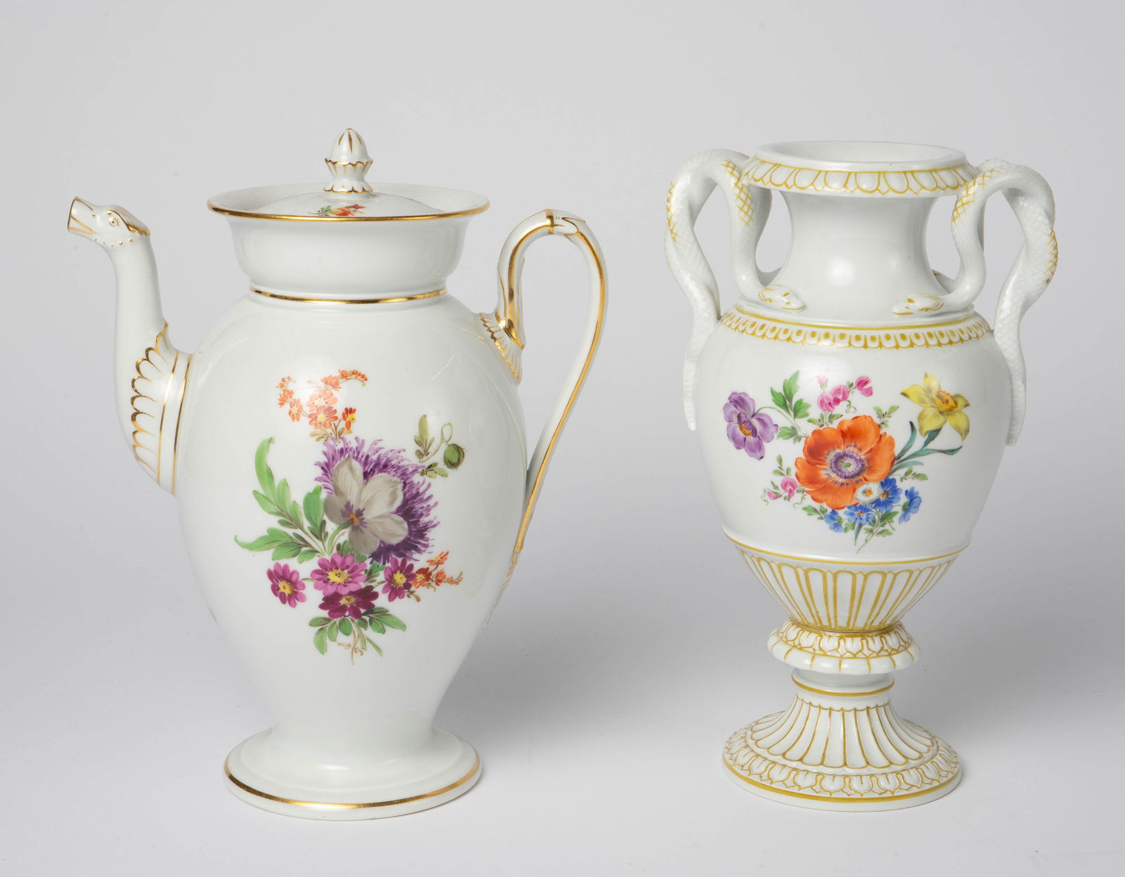Meissen Flower Bouquet Amphora Vase & Teapot.: The lot contains 2 items from the Meissen Flower Bouquet collection. Both pieces are branded appropriately on the underside. The tallest piece, the vase with snake handles, measures 8 3/4" x 5 1/4" x