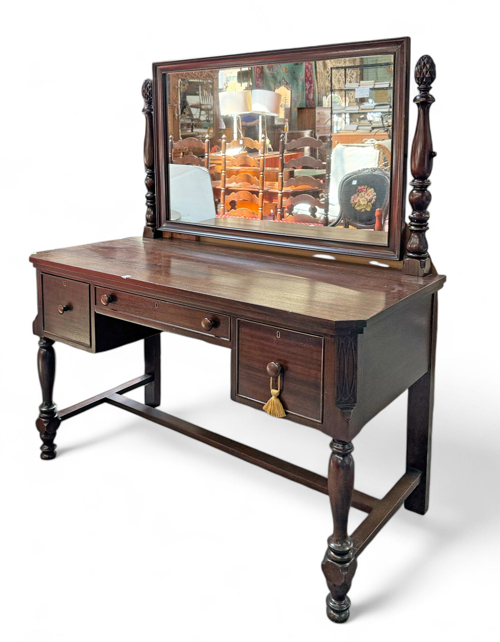 Carved Mahogany Dresser or Vanity w/ Mirror.: The piece has a swing mirror, carved pineapples, and 3 drawers with wooden knobs. It measures 30" x 50" x 24", and the mirror measures 28" x 40 1/2". There are a few scratches on the piece. Otherwise,