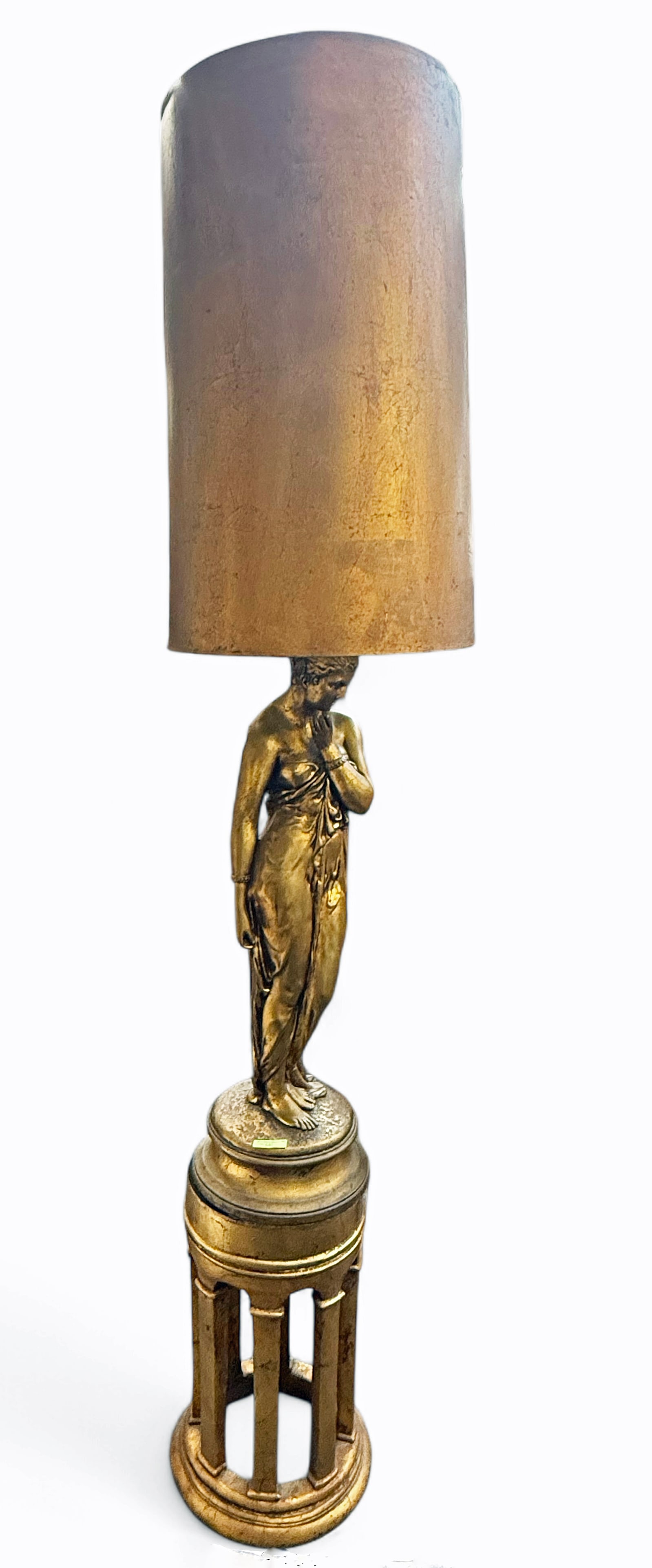 Gilded Floor Lamp on Pedestal w/ Maiden.: The electrified floor lamp is composed of a gilded composition sculpture of a draped maiden on a giltwood pedestal with columns. The piece measures 74 1/4" x 17 3/4" x 17 3/4". The top can be separate