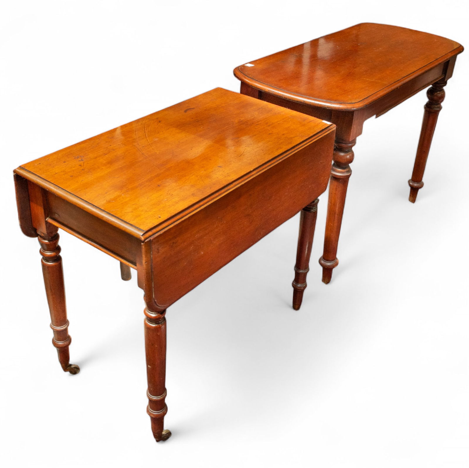 Lot of Two Vintage Tables.: This lot includes a dropleaf table and a console table. Both have turned legs, and the dropleaf table sits on casters. Both tables have a worn patina, but are in good solid condition overall. The drop