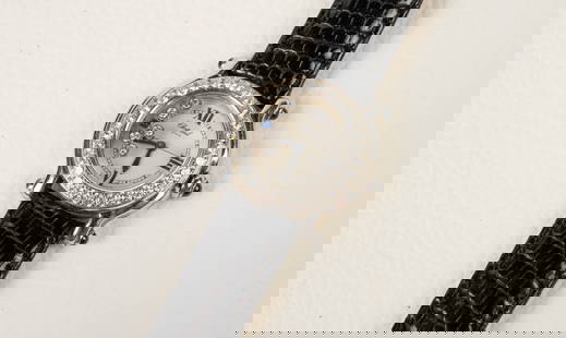 Chopard Happy Sport Watch w/ Diamonds.: The watch is marked Chopard / Happy Sport / 27 8245-23 / 472940 / 8245 on the back of the case. It features a stainless steel case with a round diamond rim, and 6 free flowing stones inside the face.