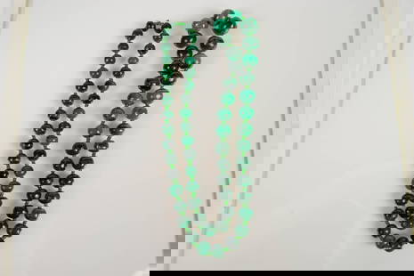 Heavy Malachite Beaded Necklace.: The graduated beaded necklace measures 26" long. The smallest beads measure 8mm wide, and the largest bead measures 13mm wide. It weighs 125.2 Grams. One of the largest beads is cracked, but holds its