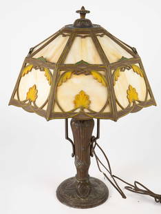 Art Nouveau Table Lamp w/ Slag Glass Shade.: It looks to be painted white metal, with some of the finish flaking off. The octagonal glass shade has some cracks, and one of the panels is missing a corner. The lamp will need to be rewired, as the