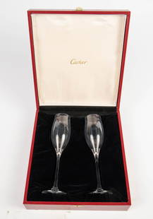 Cartier Pair of Champagne Flutes w/ Storage Case.: They are crystal champagne flutes, each measuring 8 7/8" tall, and 2 1/2" in diameter across the base. The storage case measures 11 1/8" x 10 18" x 3 1/2". In-house shipping is available. Please see o