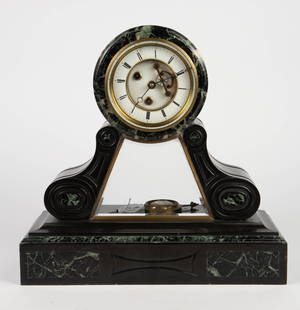 French Slate & Marble Mantel Clock.: The heavy clock features carved black slate with green and black marble sections and inlay. It measures 16" x 16 3/4" x 6 1/4". It has brass hardware and a thick crystal. The back mechanism crystal is