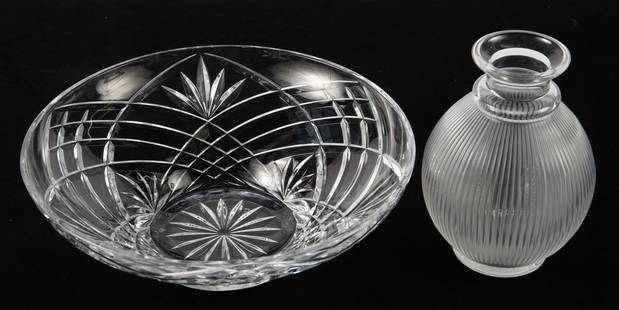 Lot: 2 Crystal Pcs.- Lalique, Marquis by Waterford: The lot includes a Marquis by Waterford centerpiece bowl and a Lalique Langeais ribbed decanter bottle with no stopper. They both look to be in good condition. The bowl measures 12" across the rim, an