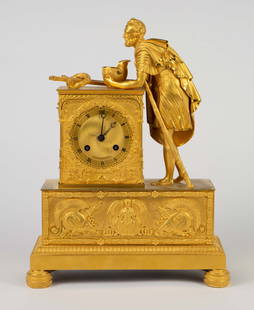 Early 1800's French Gilt Bronze Figural Clock.: The clock works. A key is included. This footed clock is decorated with flower and leaf garlands, battle helmets, and a female angel. The figure next to the dial is an older soldier with a staff and w