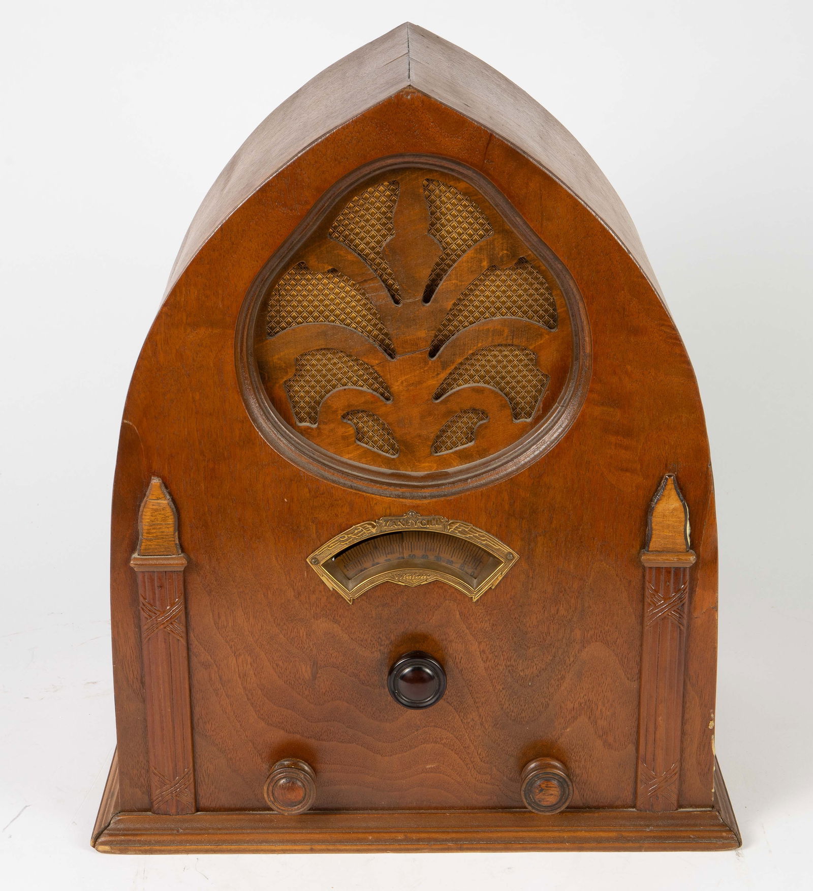 Zaney Gill Vitatone Vintage Cathedral Radio.: We were able to power on this item, though the tuning function likely needs repair. The radio has two wood knobs and what looks to be a Bakelite knob. It may need rewiring and/or other work done.There