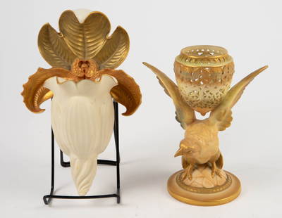 Lot: 2 Antique Royal Worcester Vases- Bird, Orchid: The tabletop potpourri vase resembles a bird with outstretched wings, supporting a reticulated cup with angel heads. There is no lid. The wall pocket flower vase resembles an orchid with gilded petals