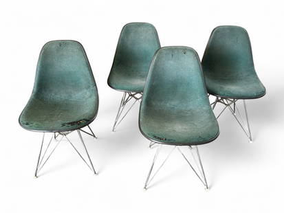 Set of 4 Herman Miller Eames Eiffel Tower Chairs.: The chairs are a Charles and Ray Eames design. They have Eiffel Tower bases and all of their original toe caps. They are stamped with their original Herman Miller logo on the undersides. The green uph
