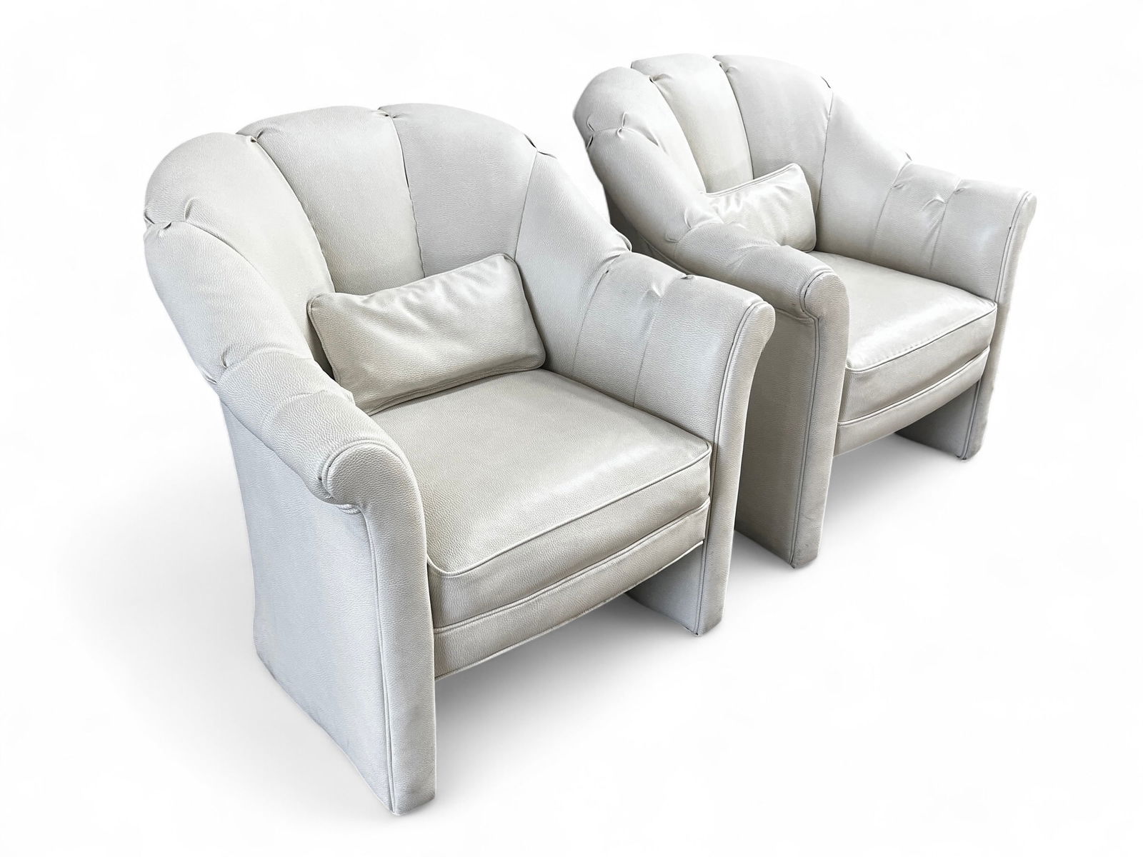Pair of Groll Erail Wittman Club Chairs, White.: The pair of unsigned club chairs were designed by Groll Erail Wittman for Hoffman Furniture. Both pieces have been redone in an off white leather upholstery. It has a channel back design and comes wit