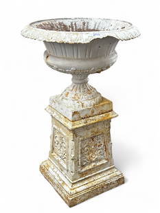 Large Cast Iron Urn - Signed.: This large vintage urn comes apart in three sections, and has floral decorations on the base. The urn has a broken piece around the rim, as well as some rust and paint loss. The top has a 27" diameter