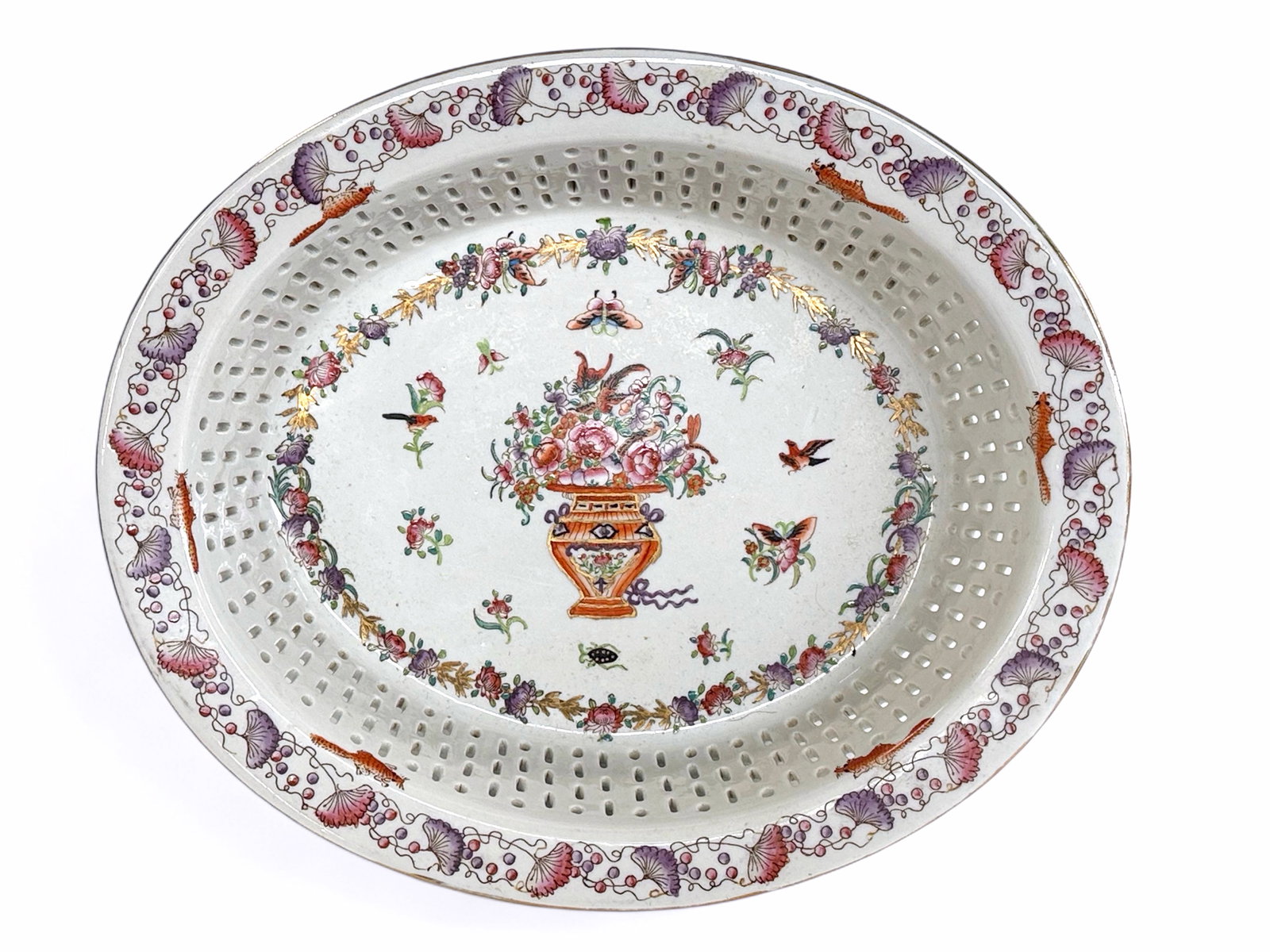 Old Chinese Export Style Oval Reticulated Bowl.: The porcelain bowl is in good overall condition. It is unmarked. The bowl has floral designs, with birds, butterflies, and squirrels. The bowl measures 2 3/4" tall, 13" wide, and 11" deep. In-house sh
