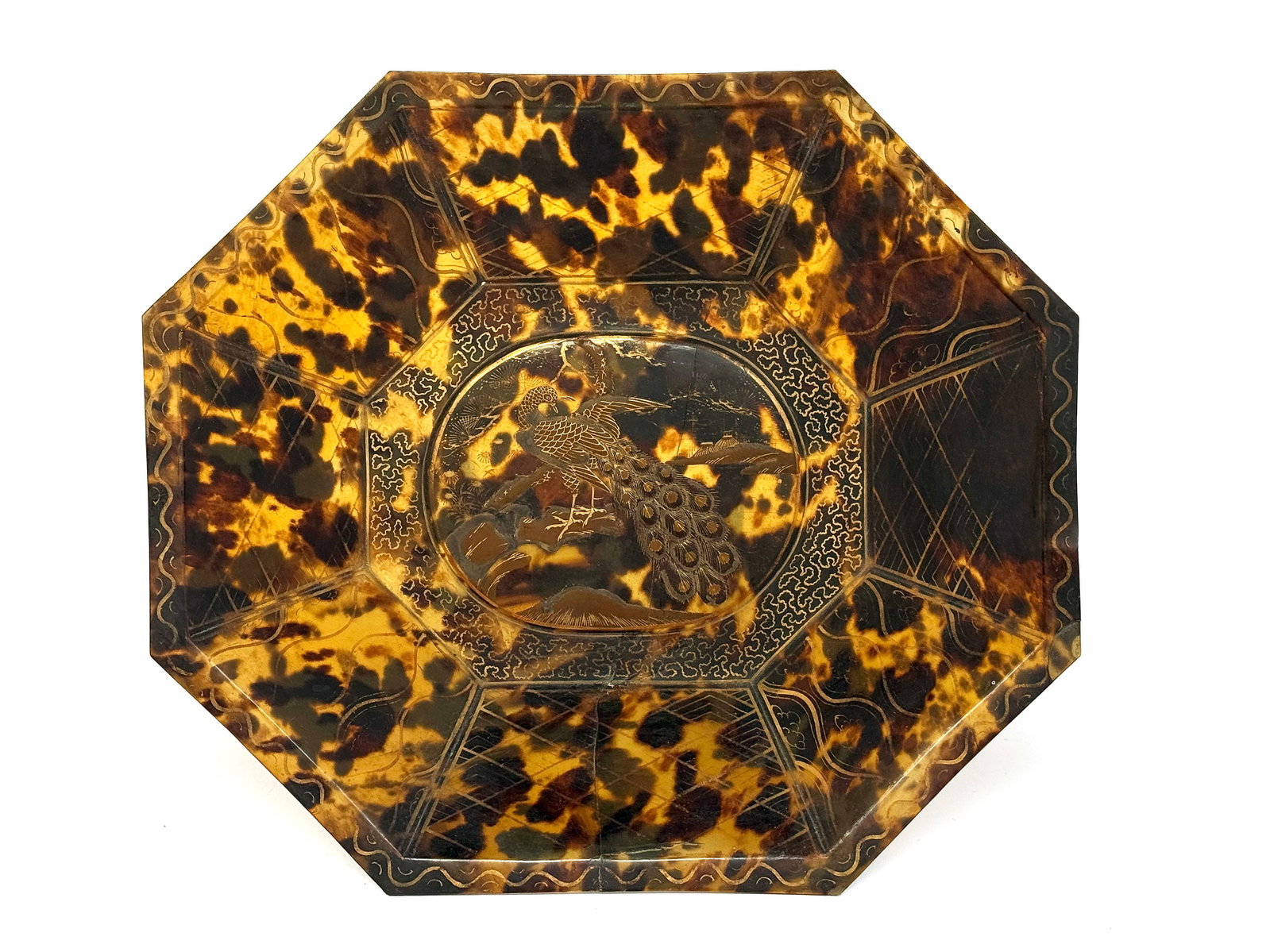 Antique Japanese Tortoise Shell Type Bowl.: The bowl has a long crack, which runs most of the width of the piece. It is likely from the Meiji period. The bowl has some gilding worn off. It has a peacock in its center. The bowl measures 1 3/8" t