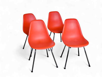 Four Eames Herman Miller Plastic Side Chairs.: These Charles and Ray Eames for Herman Miller molded plastic chairs have chrome legs and black rubber toe caps. Each one has the original label on the underside. There are a few scratches, but overall