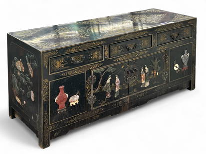 Black Lacquer Asian Chest.: This black and gold chest has appliques depicting people, vases, and flowers. There are three drawers and two doors with interior storage. It is in good overall condition, with some scratches and smal