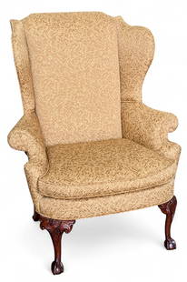Vintage Upholstered Wingback Chair.: The armchair has beige/gold upholstery, and carved legs with ball and claw feet. The seat cushion is removable. Besides some light fraying, it's in good condition. It measures 37" wide, 32" deep, and