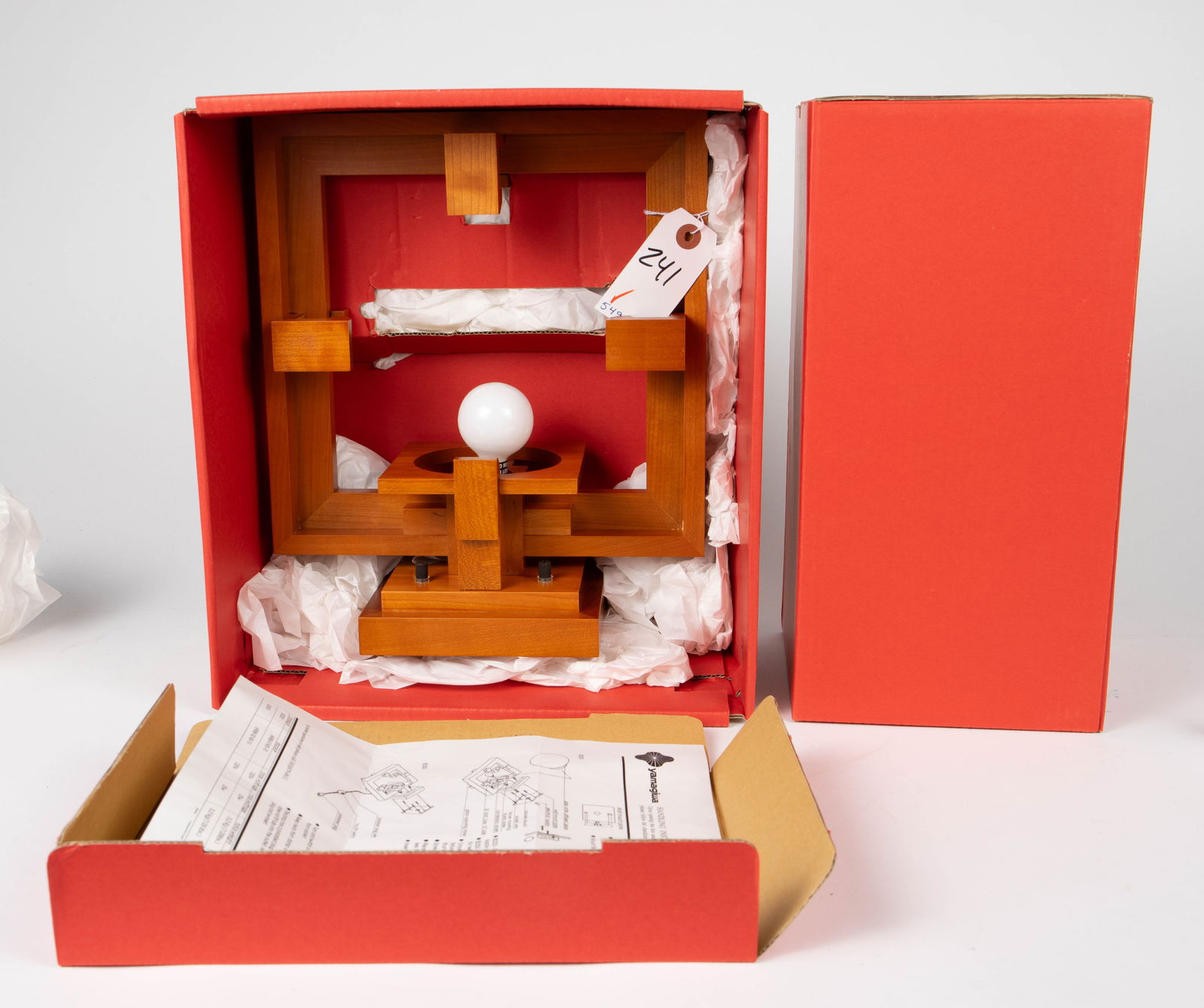 Yamagiwa Frank Lloyd Wright Robie 1 Wall Sconce.: The sconce comes with its original shipping package and materials. The box measures 15 1/2" x 22 1/2" x 8 1/4". The fixture is used, and there are a few scratches on the piece. Otherwise, it is in ove