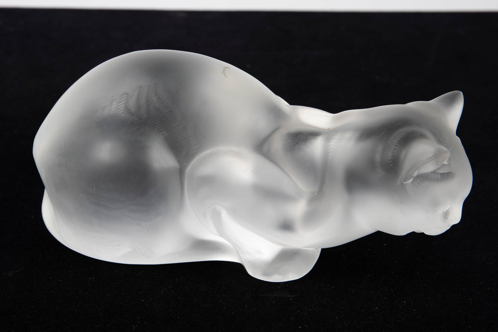 Lalique France Frosted Crystal Cat Sculpture.: The frosted crystal sculpture is signed Lalique France on the underside edge. It features a cat ready to pounce. It measure 4 5/8" x 9" x 4 3/4". There are a few minor scratches and stains on the piec