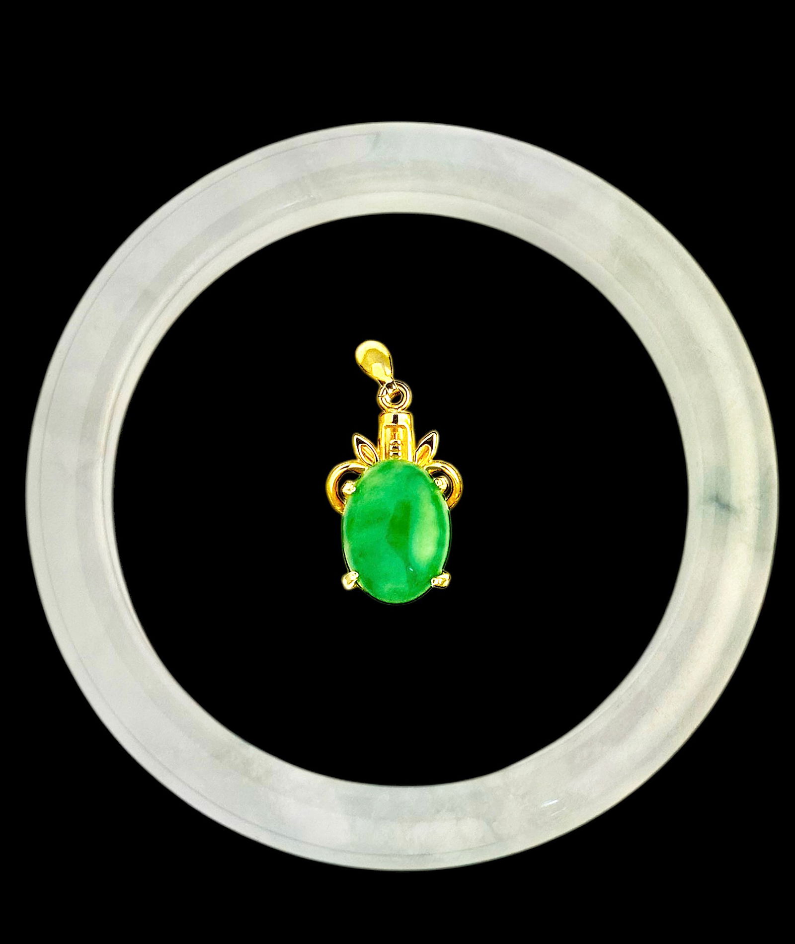 Chinese Jadeite Bangle & Jadeite Pendant.: Both pieces are in good overall condition. The pendant looks to be gold filled. It measures 7/8" long. The jadeite stone inside measures approximately 13mm x 10mm. The bangle bracelet measures 3/8" th