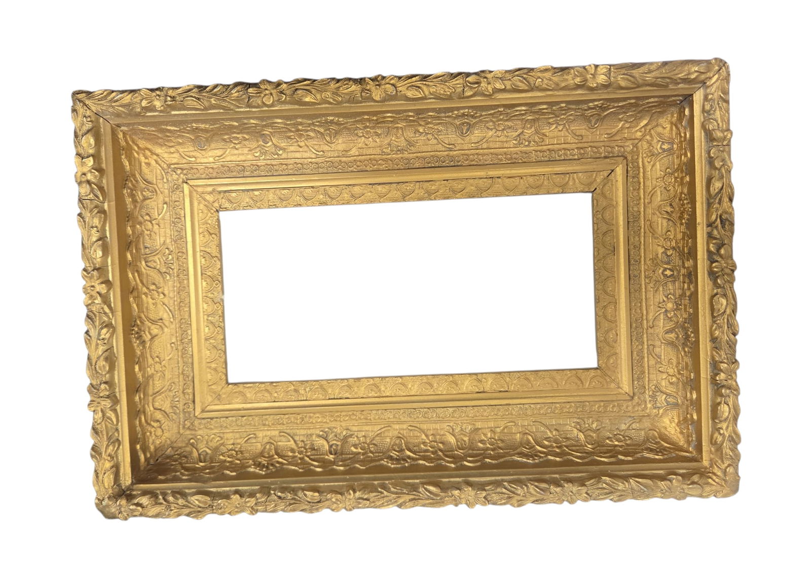 Carved and Gilded Victorian Picture Frame.: This smaller 19th Century frame looks to be in good overall condition, with some minor cracking and gilt loss. The frame opening measures 4 3/4" x 9 1/4", and the overall measurement is 9 1/4" x 14".