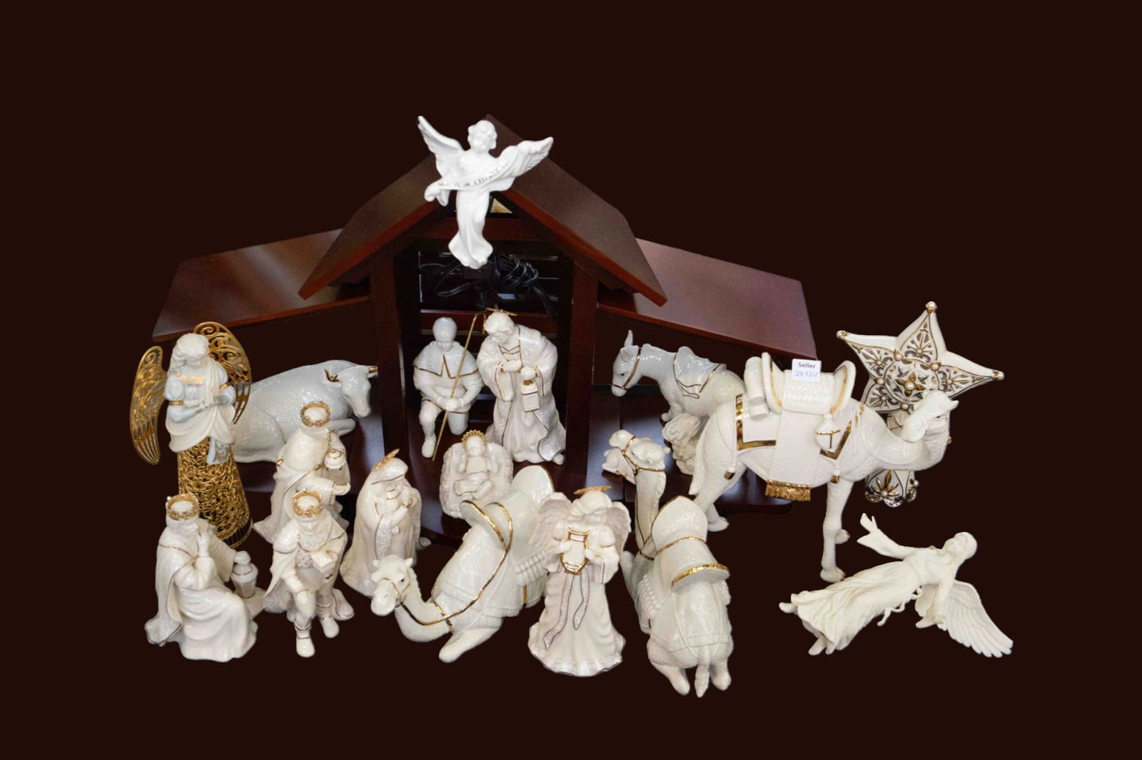 Lot of Lenox Porcelain Nativity Creche Pieces.: This lot includes the following: a light-up stable, baby Jesus, Mary, Joseph, the 3 Kings, 3 camels, a donkey, a bull, a lamb (one chipped ear), a shepherd, 2 female angels, an angel tree topper, and